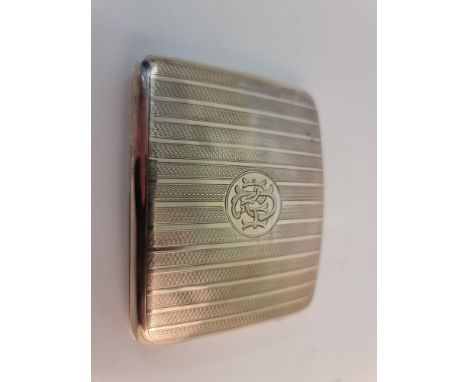 A hallmarked silver cigarette case, the rectangular design engine turned with central monogram engraving.