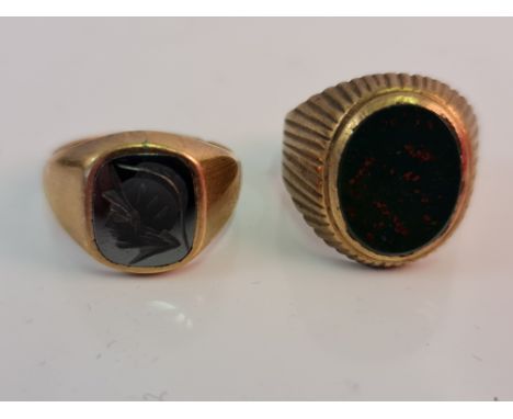 A hallmarked 9ct yellow gold hematite engraved signet ring and a hallmarked 9ct yellow gold bloodstone set signet ring, size 