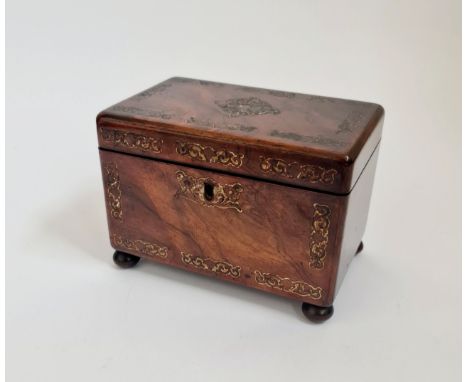 A 19th century rosewood tea caddy with mother of pearl inlaid on bun feet.