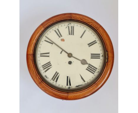 An oak round wall clock with fusee movement. 40cm.