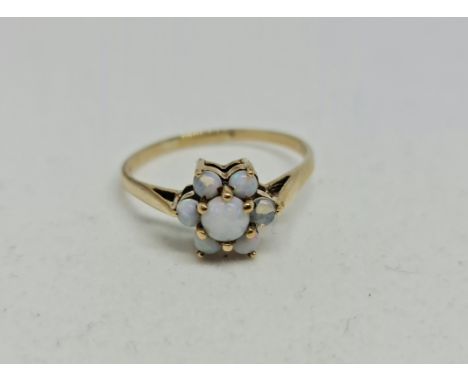 An opal cluster ring, stamped 9ct, ring size P.