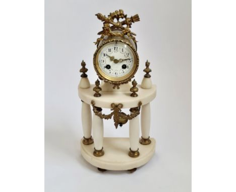 A French white marble four column portico clock with floral swag to face. 43cm.