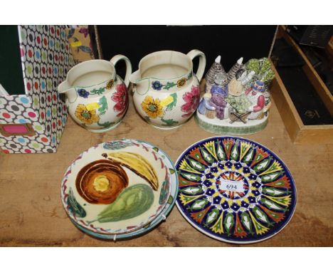 A Rye Pottery for LHL figure group, graduated pair of Wedgwood jugs, decorative pottery plates