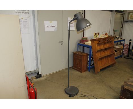 A large grey industrial style standard lamp