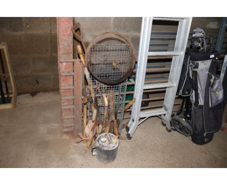A paraffin can, garden sieve, collection of hand tools