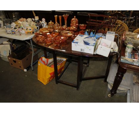 An oak Ercol gate leg dining table&nbsp;