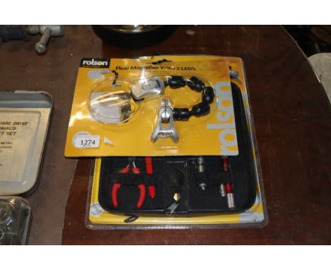 A flexi magnifier with LEDs and nine piece computer tool kit