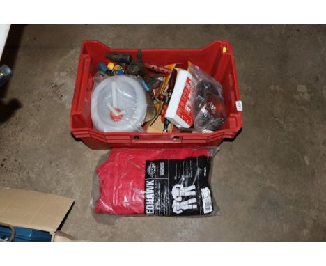 A box of assorted hand tools, blow lamps, and a coverall
