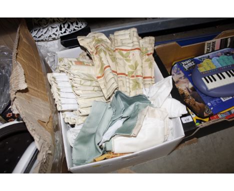 A box of curtains and material