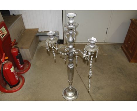 A large plated and glass decorative three light floor candelabra