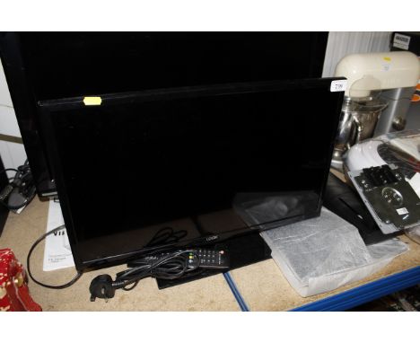A Logix flat screen television with remote control and wall bracket