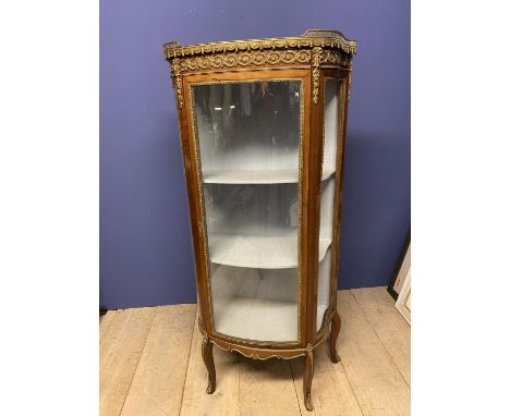 19th century Louis XVl style mahogany and gilt bronze pier cabinet with ornate gallery and marble top supported by 4 slender 