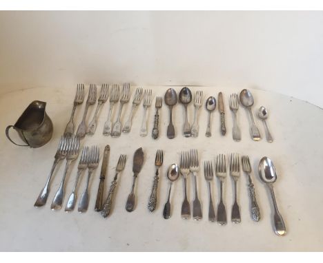 Qty of hallmarked silver flatware, mixed dates and a Victorian cream jug, crested.  Total weight 1550 grms. 49.8 ozt 