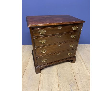 Small George lll mahogany chest of 4 graduated drawers supported on bracket feet 