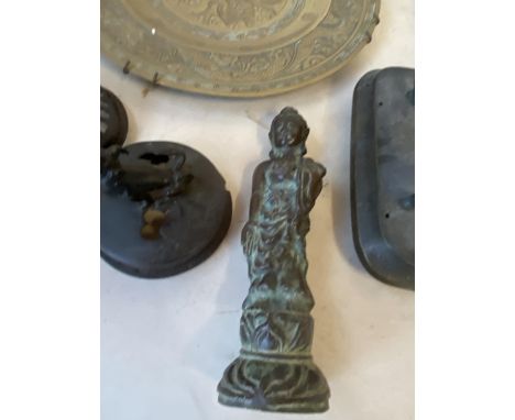 Group of Oriental bronze censer covers, a bronze figure and a bronze dragon plate 