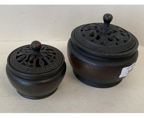 2 Chinese bronze pots with pierced lids, marks to base, 10cm D &amp; 7.5cm (condition some wear) 