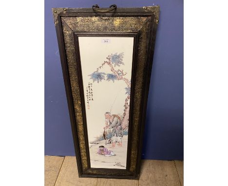 Chinese ceramic screen decorated with a fisherman mounted in a wooden and embossed metal frame, the pair 74 x 22cm (condition