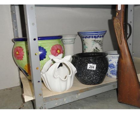 A shelf of plant pots