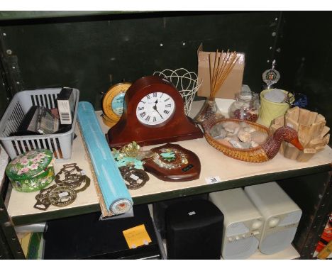 A shelf of miscellaneous including horse brasses & clock etc.