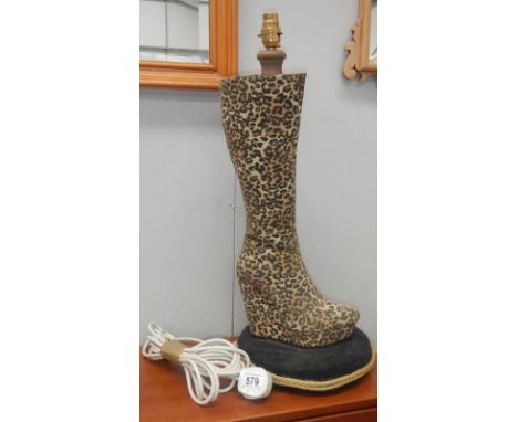 A leopard print boot table lamp