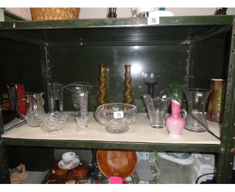 A shelf of assorted glassware including glass bowl etc