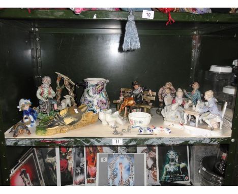 A shelf of figures including Capo-di-Monte style figures