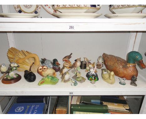A shelf of assorted bird figures