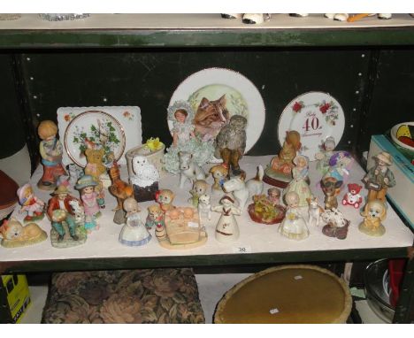 A shelf of assorted figures including animals