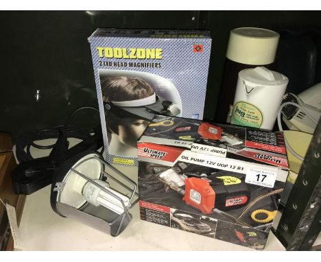 An electric car mechanics clamp light &amp; oil pump etc.