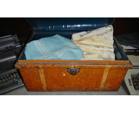 A tin trunk with contents