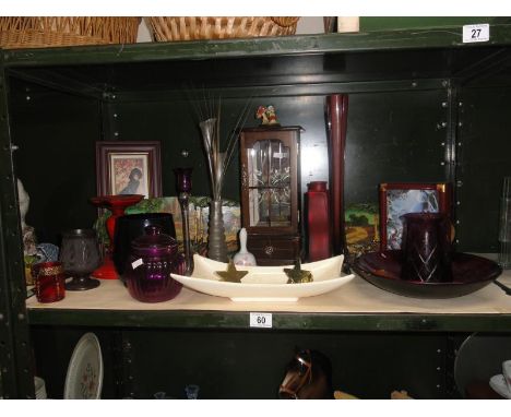 A shelf of miscellaneous including coloured glass & pictures etc.