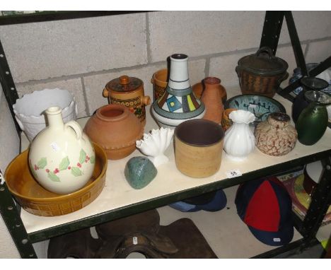A shelf of assorted pots
