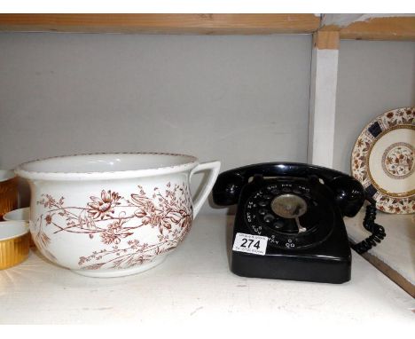 A vintage black &amp; white telephone &amp; a 19th century potty