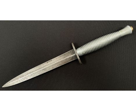 WW2 British Third Pattern Fairbairn Sykes Fighting Knife with double edged blade 179mm in length. Crossguard maker marked "Wi