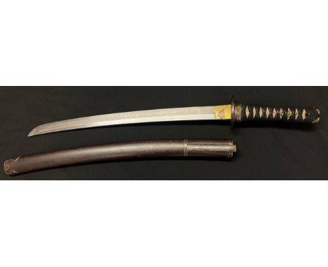 Japanese Wakizashi Short Sword with single edged blade 455mm in length. Hamon line is present. Signed tang. Tsuba with floral