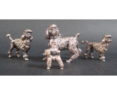 A Small Hallmarked Cast Sterling Silver Poodle, (2.4cm high) and one larger hallmarked cast silver poodle (4cm high) and two 