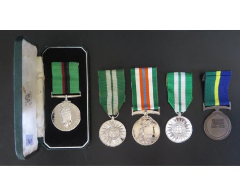 A Cased Royal Ulster Constabulary Service Medal awarded to R/CONST W SMITH and others 