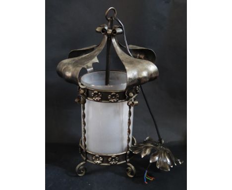 A Wrought Iron Pendant Light with frosted glass shade, c. 56cm to top of hanging loop and with matching ceiling boss 
