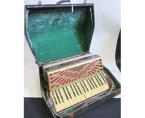 A Scandalli Vibrante Three 120 Bass Accordion in case. Some buttons have sunk.