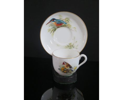 A Royal Worcester Kingfisher and Goldfinch Decorated Cup and Saucer, signed Powell, 1929, 14.5cm diam. 