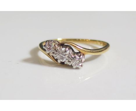 An 18ct Gold and Diamond Crossover Three Stone Ring, size K.5, 2.2g 