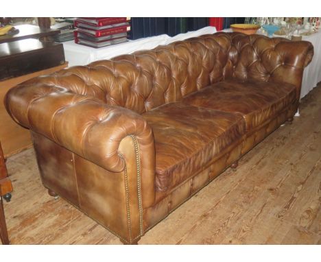 A Good Brown Leather Chesterfield Three Seater Sofa, c. 240cm wide 