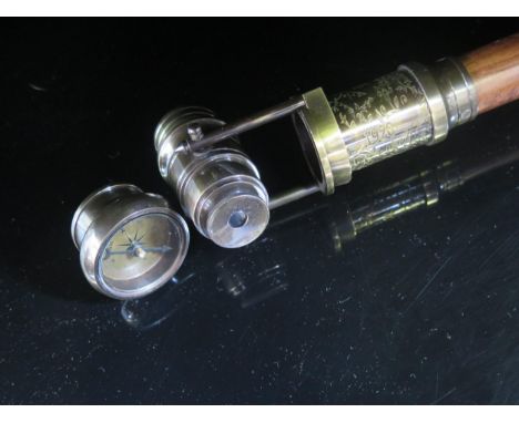 A Novelty Walking Cane incorporating a compass and monocular 