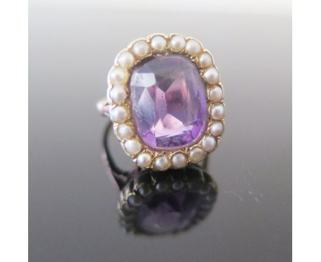 An Antique Amethyst and Pearl Dress Ring, head 18x15mm, size O.5, 6.7g. Chip to edge 