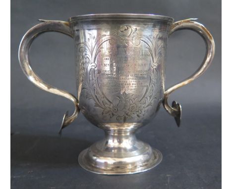 A George III Silver Presentation Loving Cup with chased scrolling foliate work, engraved "THIS SILVER CUP WITH TEA SERVICE, O