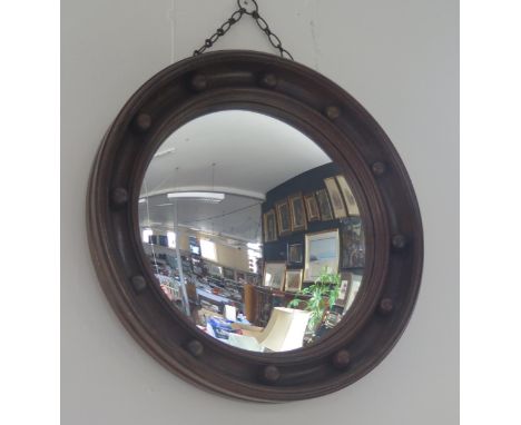 A Circular Oak Framed Convex Mirror