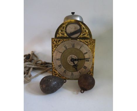 A Small English Brass Travel Wall Clock, the silvered chapter ring with brass spandrels, signed R Webster London, circa 1730,