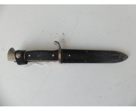 A German made Scouts knife, early 20th century, the 13cm straight single edged blade stamped ‘Anton Wingen Solingen Germany’,