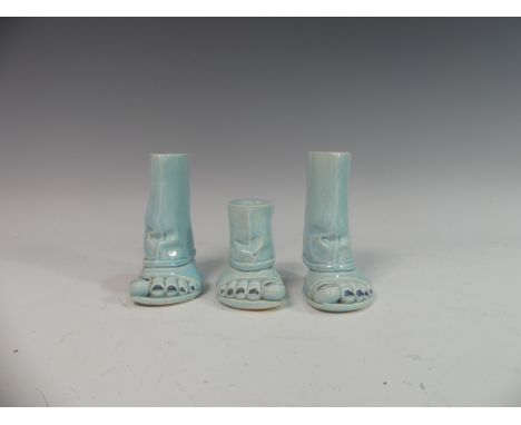 Lawson E. Rudge (b. 1936), a pair of blue glazed studio pottery Salt and Pepper Pots, modelled as feet, tallest 14cm (3)&nbsp