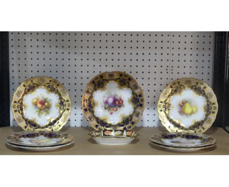An early 20thC Royal Worcester part Dessert Service,&nbsp;each piece decorated with fruit and set within a gilt border, all p